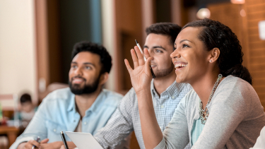 3 SRH International College students sit in class