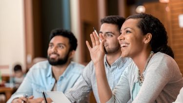 3 SRH International College students sit in class